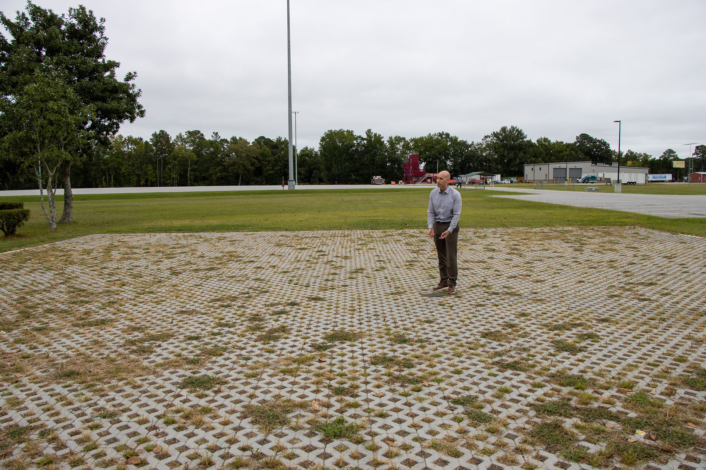 Doug Keller of RK&K Services standing on the new permeable pavement parking lot at BCCC